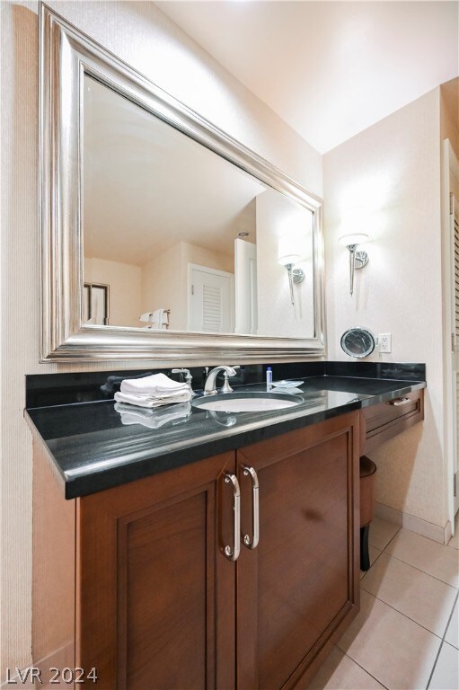 bathroom with vanity and tile floors