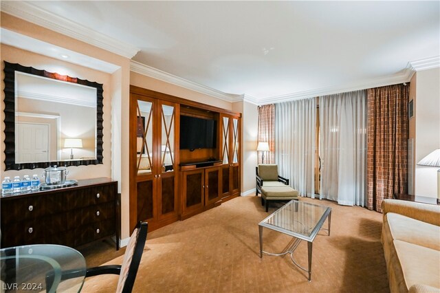 living area with crown molding and light colored carpet