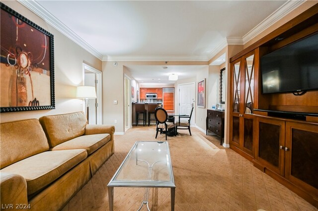 carpeted living room with ornamental molding