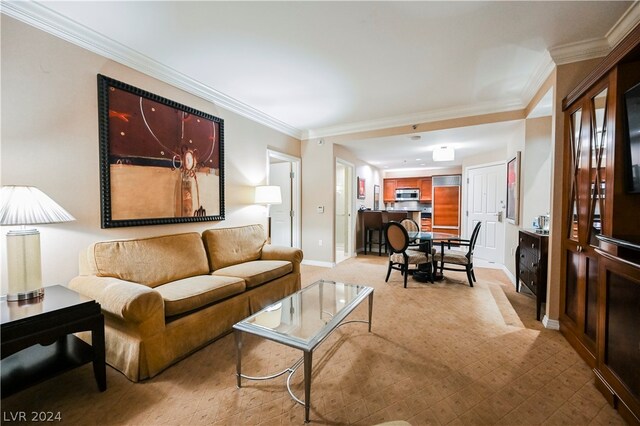 living room with ornamental molding and light carpet