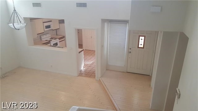 foyer entrance with light wood-type flooring