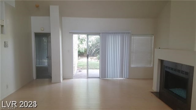 unfurnished living room with light hardwood / wood-style floors