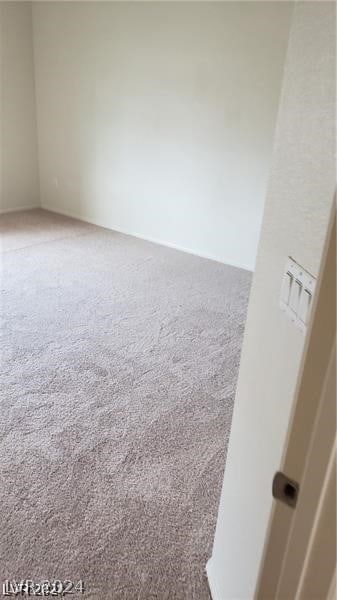 unfurnished room featuring carpet floors