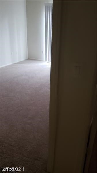 empty room with carpet flooring