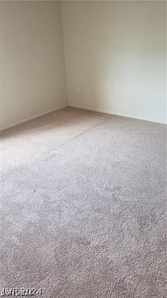 unfurnished room featuring carpet floors