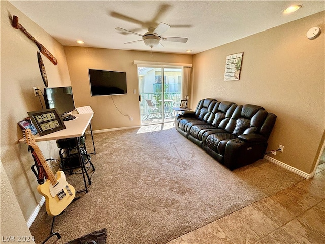 tiled living room with ceiling fan