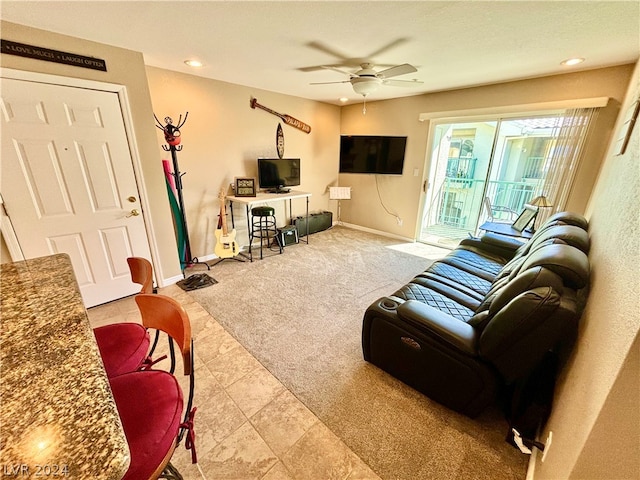 living room with ceiling fan and light colored carpet