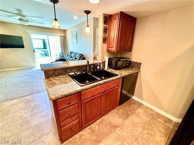 kitchen with black appliances, sink, ceiling fan, light stone countertops, and decorative light fixtures