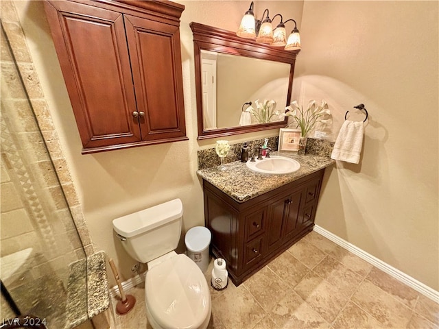 bathroom featuring tile flooring, toilet, and vanity