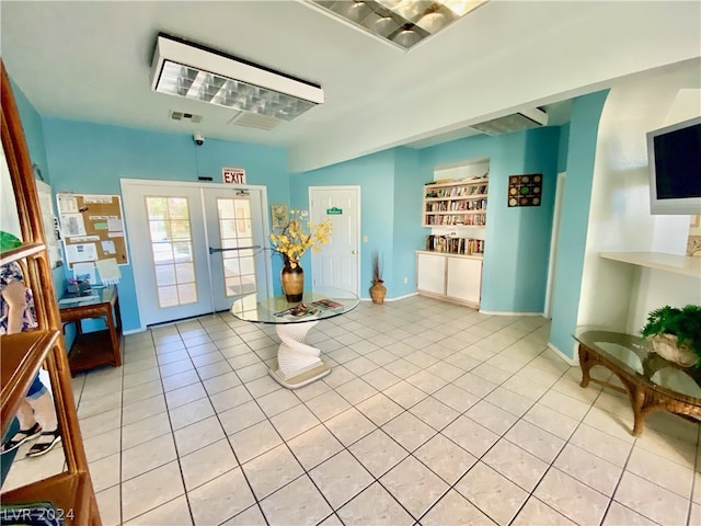 interior space with french doors and light tile flooring