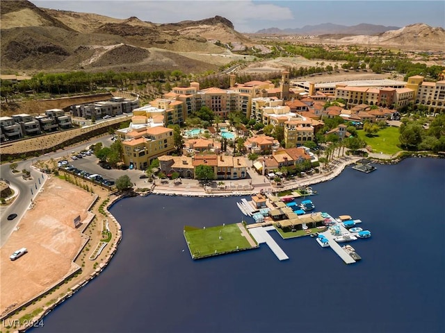 bird's eye view with a water and mountain view