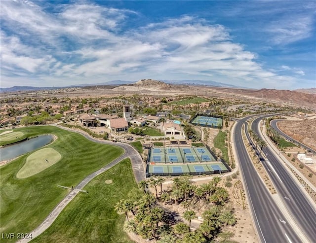 drone / aerial view with a water and mountain view