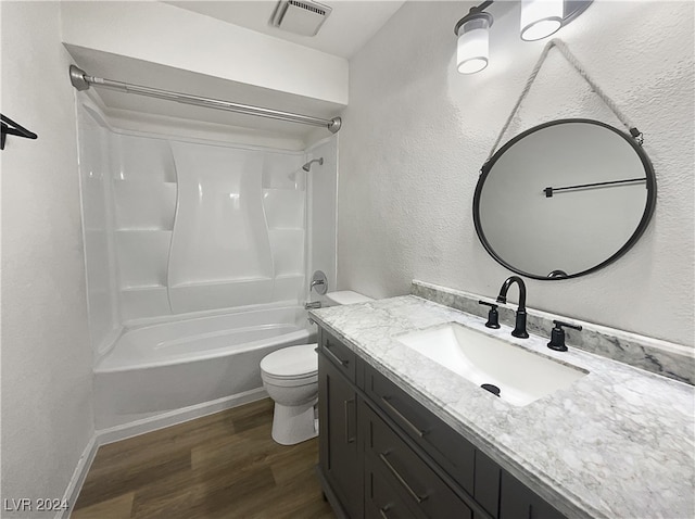 full bathroom featuring shower / bath combination, wood-type flooring, toilet, and vanity