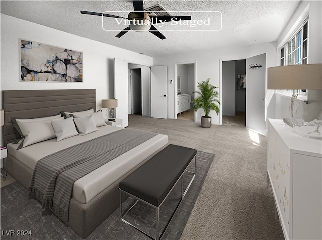 carpeted bedroom with ceiling fan and a textured ceiling