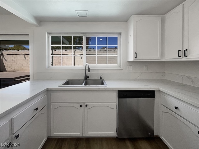 kitchen featuring sink, dishwasher, white cabinets, and dark hardwood / wood-style flooring