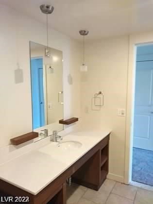 bathroom with vanity and tile floors