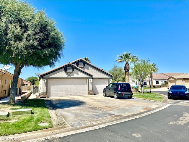 single story home featuring a garage