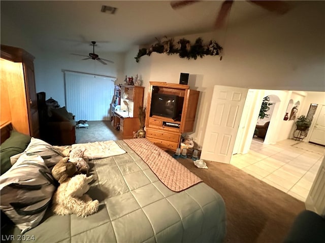 bedroom with light tile flooring and ceiling fan