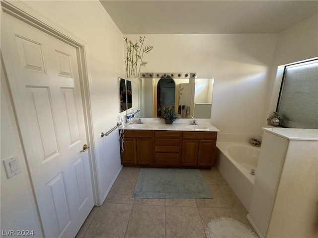 bathroom with tile floors, a washtub, and double sink vanity