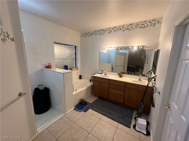 bathroom with tile floors, a washtub, and double sink vanity