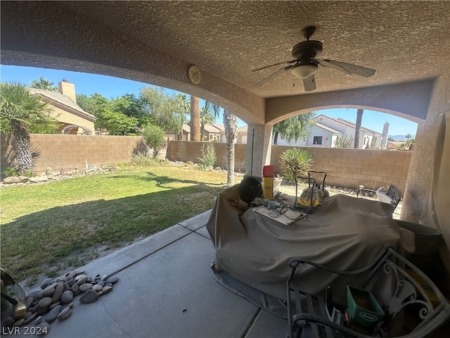 view of patio / terrace with ceiling fan and grilling area