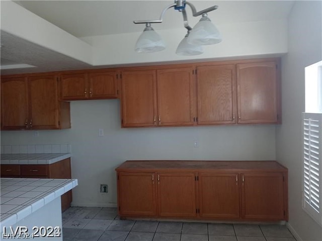 kitchen with light tile flooring