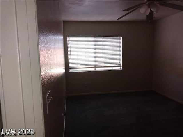 spare room with ceiling fan