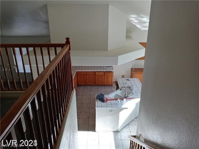 stairs featuring light tile floors