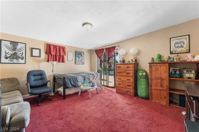 carpeted bedroom featuring a textured ceiling