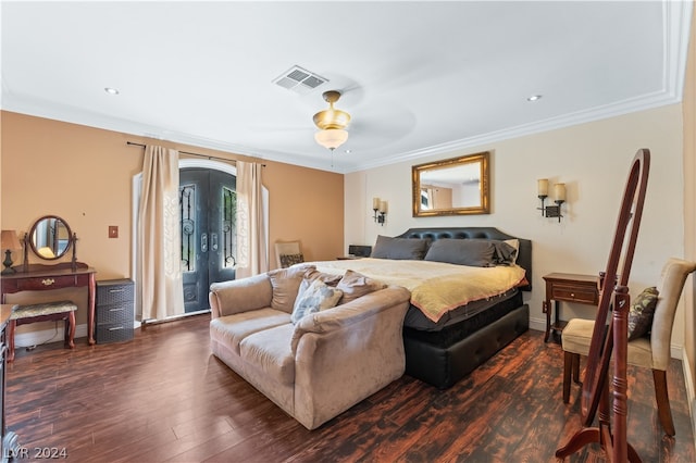 bedroom with crown molding, ceiling fan, and dark hardwood / wood-style floors