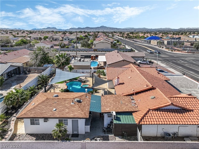 birds eye view of property with a mountain view