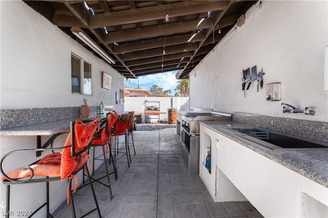 view of patio / terrace with an outdoor wet bar