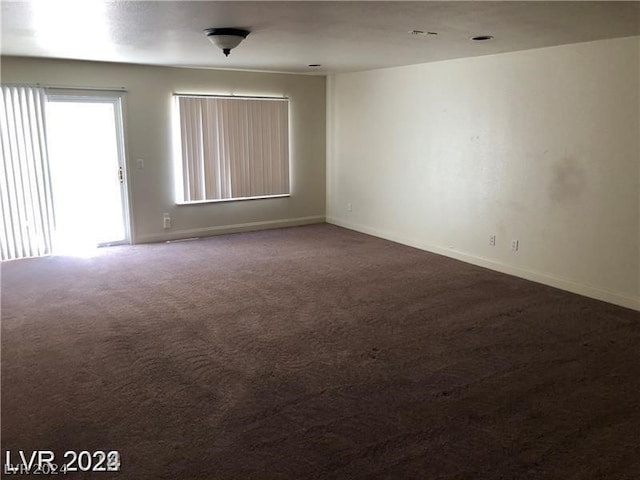 unfurnished room with carpet floors