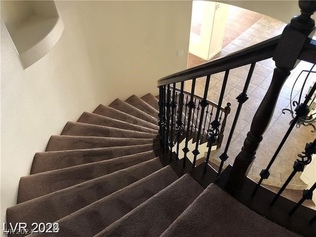 staircase with tile floors