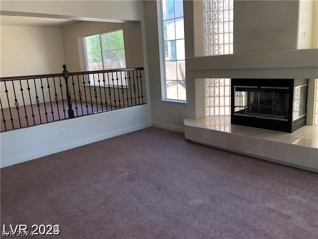 unfurnished living room with light carpet