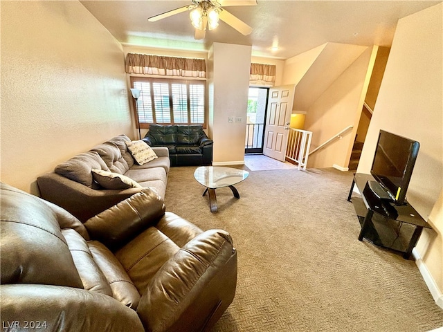 carpeted living room with ceiling fan