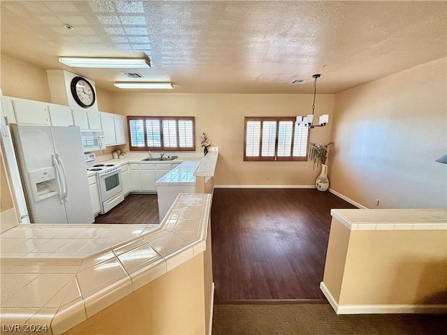 kitchen with white appliances, white cabinetry, tile countertops, sink, and dark hardwood / wood-style flooring