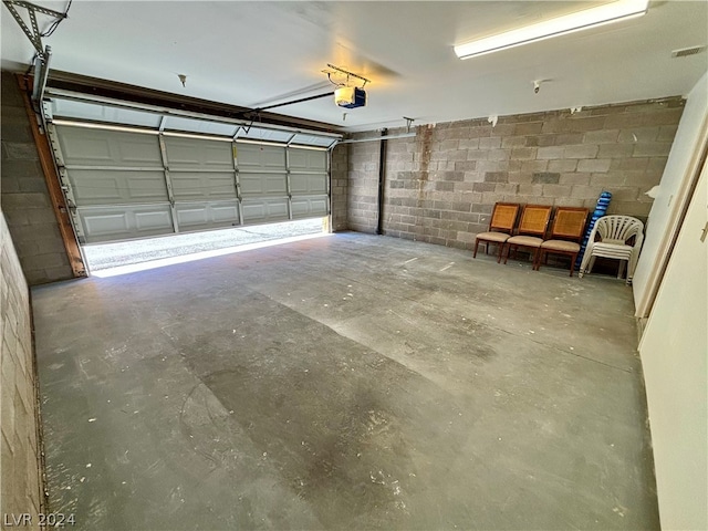 garage featuring a garage door opener