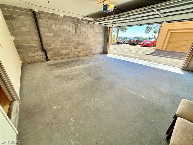 garage featuring a carport and a garage door opener