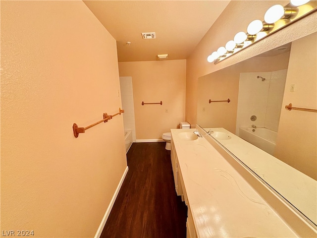 full bathroom with shower / bath combination, wood-type flooring, toilet, and vanity