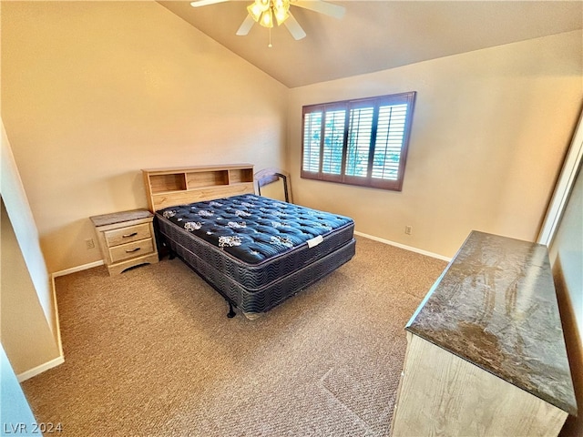 bedroom featuring vaulted ceiling, ceiling fan, and light carpet