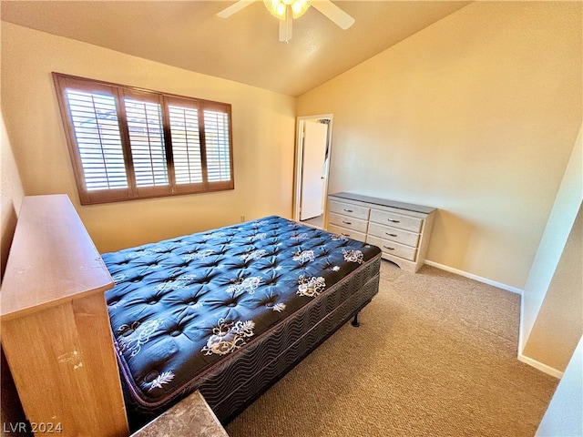 bedroom with light colored carpet, lofted ceiling, and ceiling fan