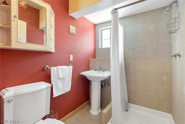 bathroom with walk in shower, toilet, and tile floors