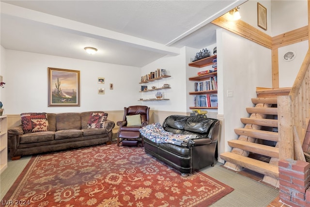 living room with a textured ceiling and light carpet