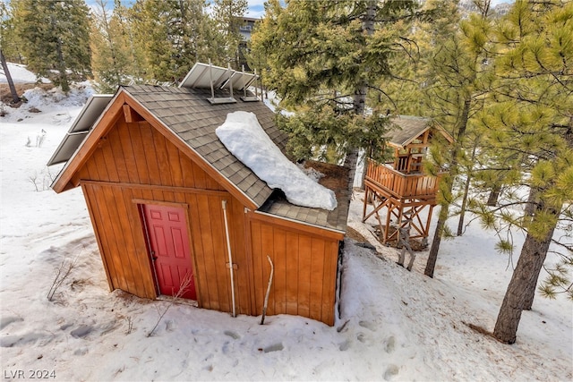 exterior space with a shed