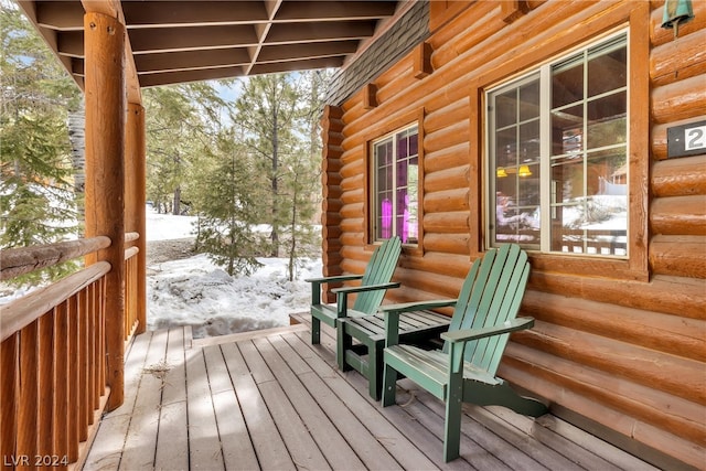 view of snow covered deck