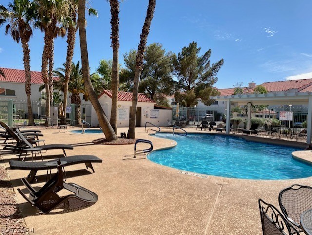 view of pool featuring a patio