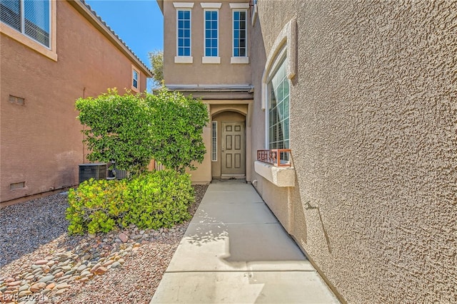 entrance to property featuring central AC