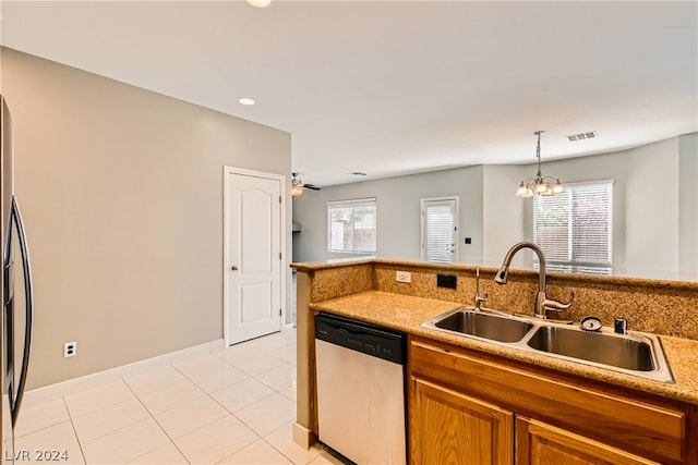 kitchen featuring dishwasher, pendant lighting, a notable chandelier, light tile floors, and sink