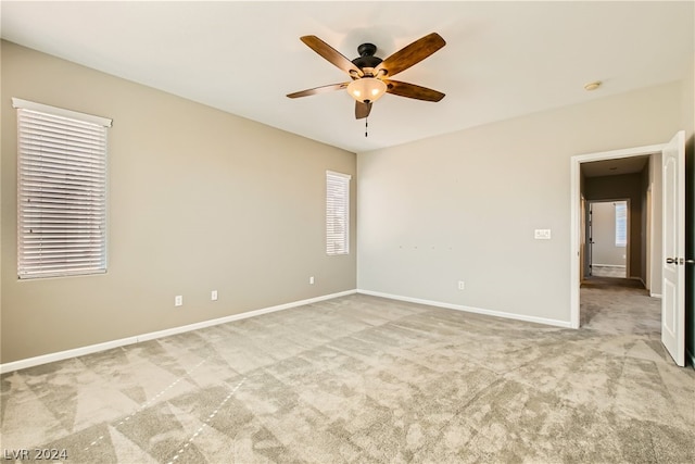 carpeted empty room with ceiling fan